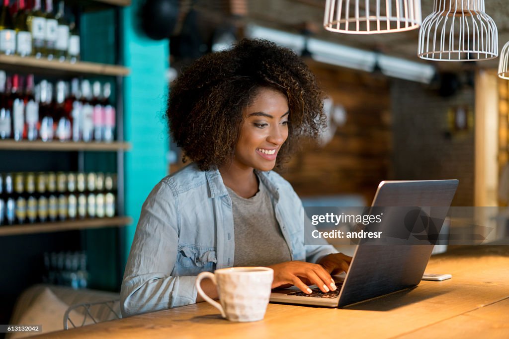 Casual woman working at a cafe