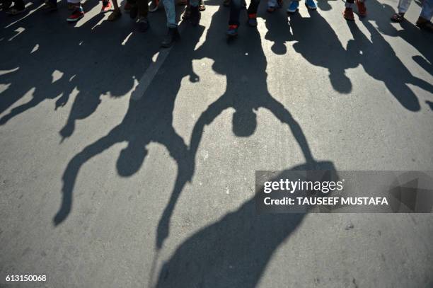 Kashmiri protestors shout pro-freedom slogans during a protest against the death of civilians in Kashmir's ongoing summer unrest, in Srinagar on...