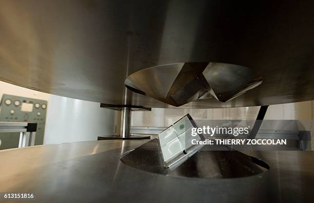 Photo taken on July 11, 2016 shows the jaws of a 1,500 ton multi-anvil press closing on a sample held between eight cubes of tungsten carbide at the...