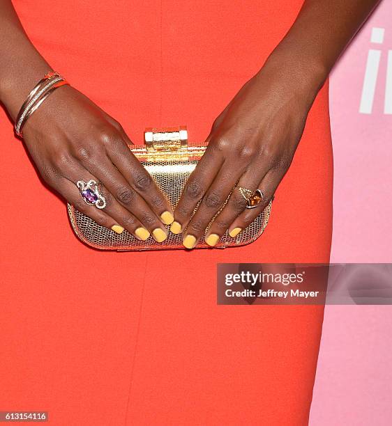 Creator/executive producer/actress Issa Rae, handbag, bracelet, rings detail, at the premiere of 'Insecure' at Nate Holden Performing Arts Center on...