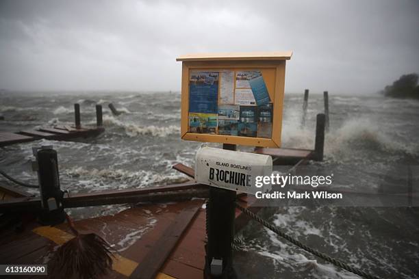 Heavy waves caused by Hurricane Matthew pound the boat docks at the Sunset Bar and Grill, October 7, 2016 on Cocoa Beach, Florida. Hurricane Matthew...