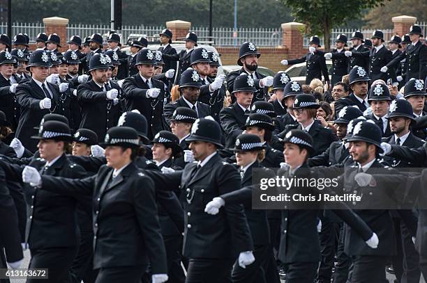 New recruits to the Metropolitan Police Service take part in their 'Passing Out Parade' outside Peel House at Hendon Police College on October 7,...