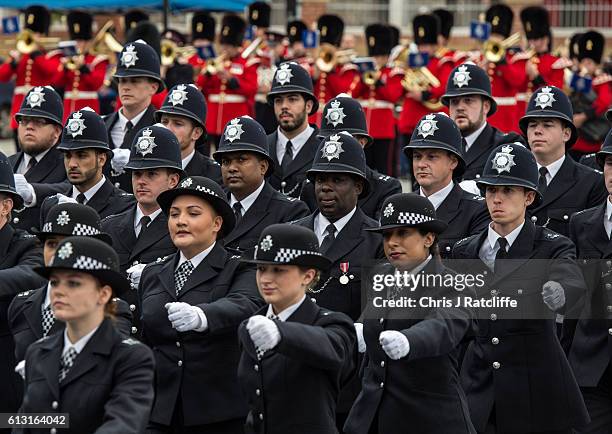 New recruits to the Metropolitan Police Service take part in their 'Passing Out Parade' outside Peel House at Hendon Police College on October 7,...