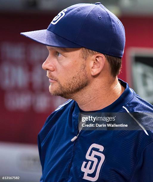 Manager Andy Green of the San Diego Padres watches the video board before the MLB game between the San Diego Padres and Arizona Diamondbacks at Chase...