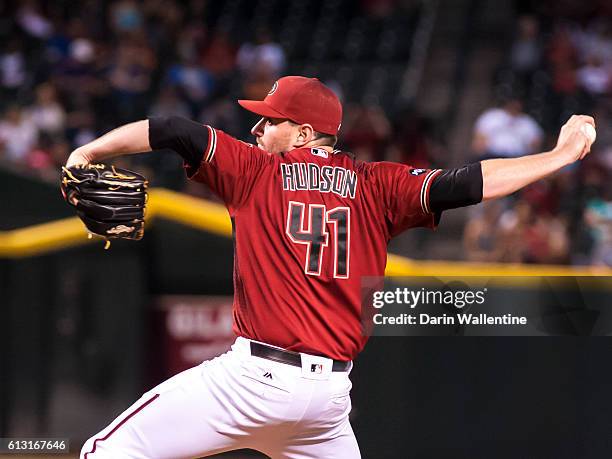 Relief pitcher Daniel Hudson of the Arizona Diamondbacks delivers a pitch in the ninth inning of the MLB game against the San Diego Padres at Chase...