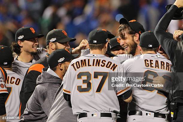 October 5: Pitcher Madison Bumgarner of the San Francisco Giants is mobbed by team mates after his nine inning shut out during the San Francisco...