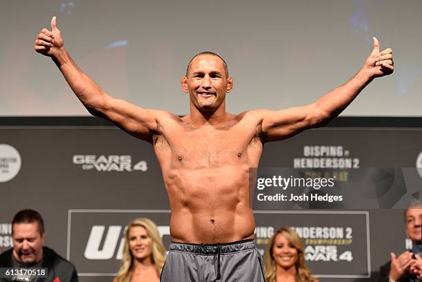 Dan Henderson of the United States steps onto the scale during the UFC 204 weigh-in at the Manchester Central Convention Complex on October 7, 2016...