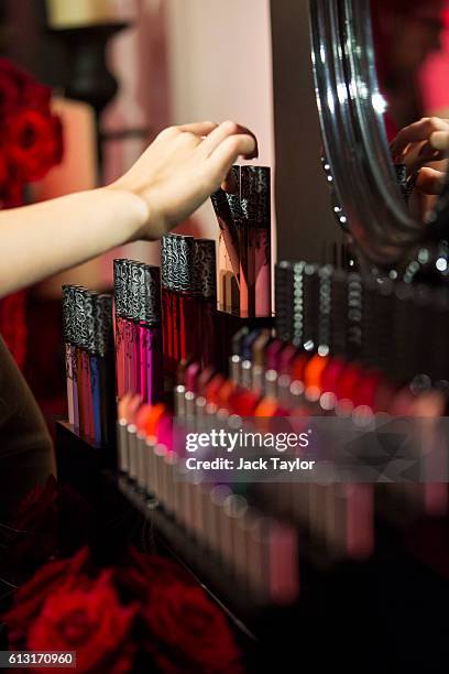 Guests try the make-up on display at the influencer launch of the new Kat Von D Beauty range at 15 Bateman Street in Soho on October 7, 2016 in...