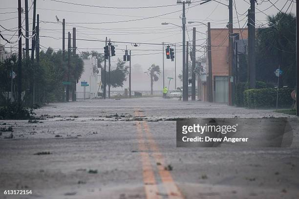 Water covers a road leading toward the Halifax River and Daytona Beach after Hurricane Matthew passes through on October 7, 2016 in Daytona Beach,...