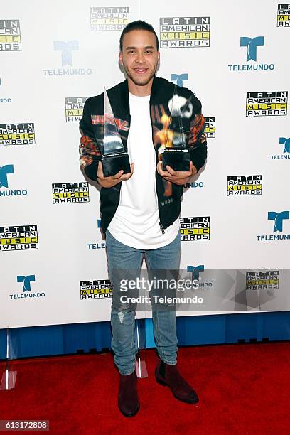 Press Room" -- Pictured: Recording artist Prince Royce poses with awards backstage at the 2016 Latin American Music Awards at the Dolby Theater in...