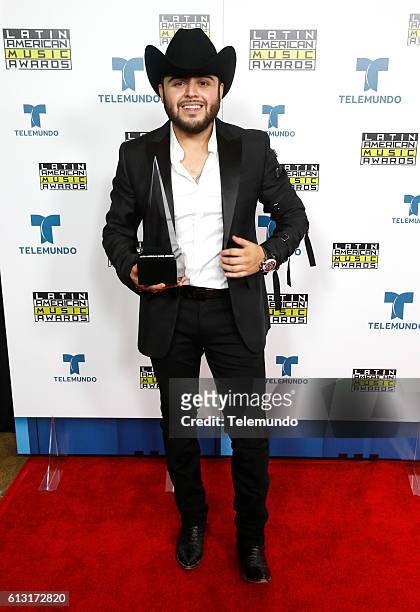 Press Room" -- Pictured: Recording artist Gerardo Ortiz poses backstage at the 2016 Latin American Music Awards at the Dolby Theater in Los Angeles,...