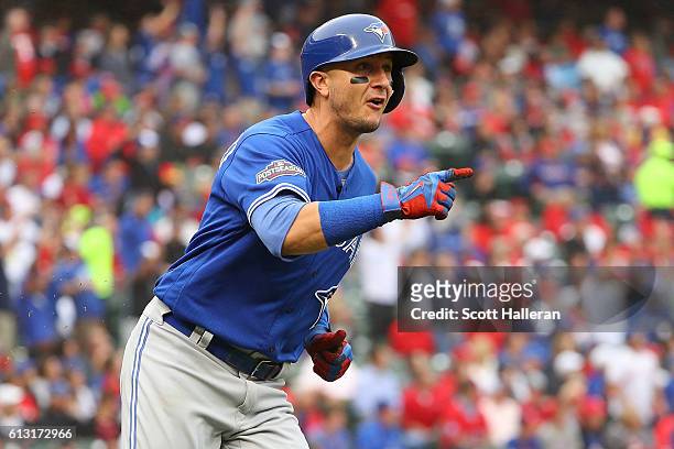 Troy Tulowitzki of the Toronto Blue Jays reacts after hitting a home run against the Texas Rangers during the second inning in game two of the...