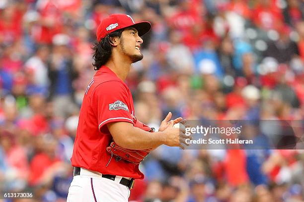 Yu Darvish of the Texas Rangers reacts after giving up a home run to Troy Tulowitzki of the Toronto Blue Jays in the second inning of game two of the...