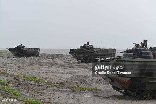 Marines amphibious assault vehicles land on a beach during military exercises with their Philippine marine counterparts on October 7, 2016 in...