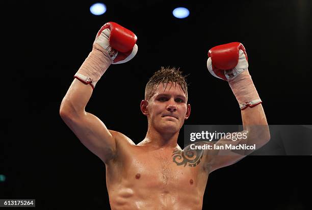 Lewis Paulin celebrates victory over Adrian Fuzesi in a Featherweight contest at The SSE Hydro on October 7, 2016 in Glasgow, Scotland.
