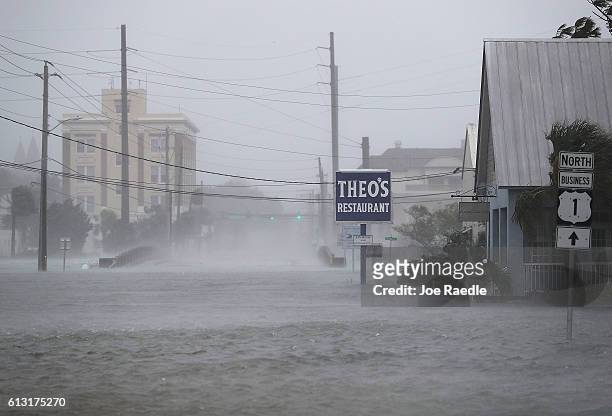 High winds stir up a flooded street as Hurricane Matthew passes through the area on October 7, 2016 in St Augustine, Florida. Florida, Georgia, South...