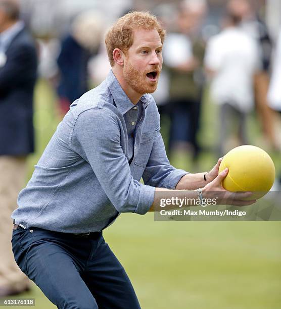 Prince Harry takes part in a training session as he attends an event to mark the expansion of the Coach Core sports coaching apprenticeship programme...