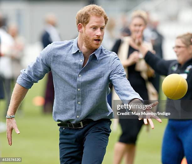 Prince Harry takes part in a training session as he attends an event to mark the expansion of the Coach Core sports coaching apprenticeship programme...