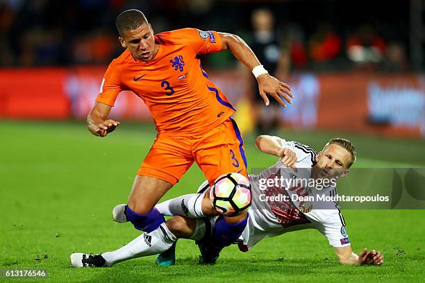 Jeffrey Bruma of the Netherlands battles for the ball with Sergei Kryvets of Belarus during the FIFA 2018 World Cup Qualifier between Netherlands and...