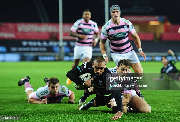 Eli Walker of the Ospreys goes over for his sides second try during the Guiness Pro12 match between the Ospreys and Cardiff Blues at the Liberty...