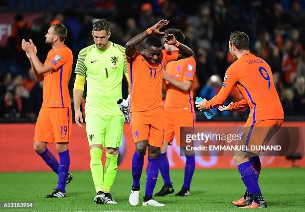 Netherlands' Quincy Promes and Netherlands' Vincent Janssen celebrate after their team's victory during the FIFA World Cup 2018 qualification...