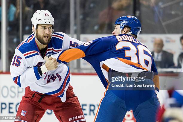 New York Rangers Left Winger Tanner Glass and New York Islanders Left Winger Eric Boulton square off during a preseason NHL game between the New York...