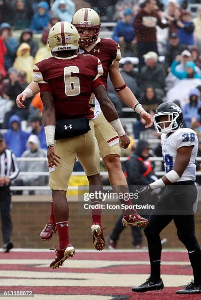 Boston College wide receiver Michael Walker celebrates his touchdown with Boston College wide receiver Jeff Smith . The Boston College Eagles...