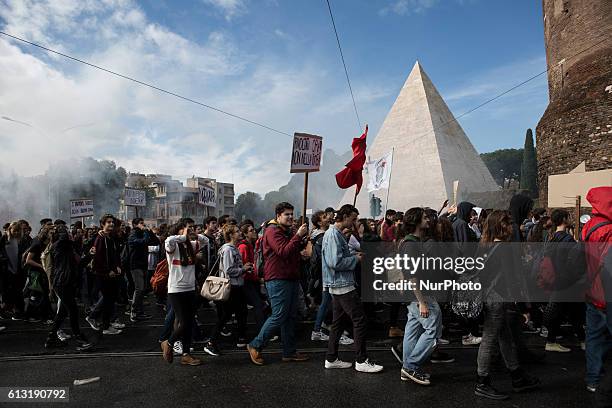 Students march in downtown Rome during a demonstration on October 7, 2016. Thousands of students took part in demonstrations all over Italy to...