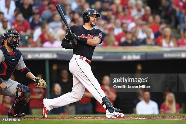 Lonnie Chisenhall of the Cleveland Indians hits a three-run home run in the second inning against the Boston Red Sox during game two of the American...