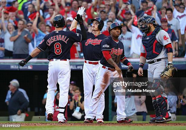 Lonnie Chisenhall of the Cleveland Indians celebrates with Brandon Guyer after hitting a three-run home run in the second inning against the Boston...