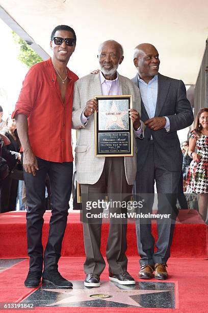 Recording artist Kenneth 'BabyFace' Edmonds, Honoree/Music Executive Clarence Avant, and Music Executive L.A. Reid attend a ceremony honoring Music...