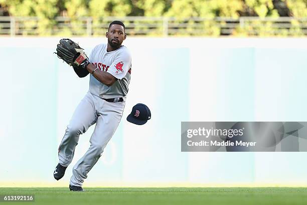 Jackie Bradley Jr. #25 of the Boston Red Sox loses his hat as he fields a ball in the second inning against the Cleveland Indians during game two of...