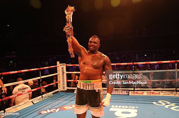Dillian White celebrates victory over Ian Lewison for the vacant British Heavyweight Championship contest at The SSE Hydro on October 7, 2016 in...