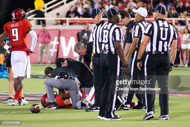Trainers check out Texas Tech quarterback Patrick Mahomes II after getting hurt on a play during the game between Kansas and Texas Tech at Jones AT&T...