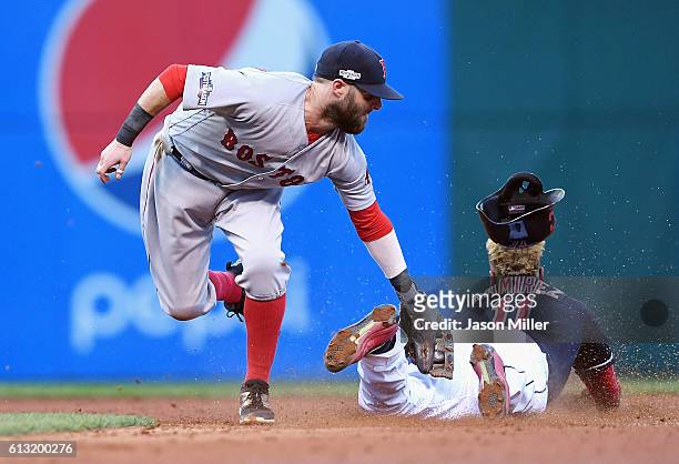 Dustin Pedroia of the Boston Red Sox tags out Jose Ramirez of the Cleveland Indians as he attempts to steal second base in the fifth inning during...
