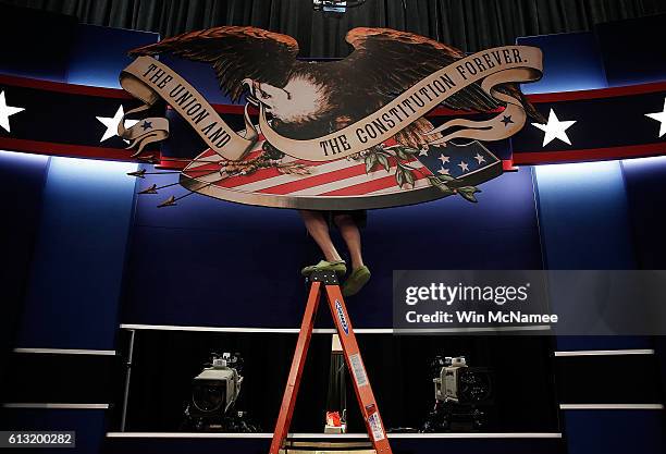 Workers prepare the stage for the second presidential debate at Washington University October 7, 2016 in St. Louis, Missouri. The second presidential...