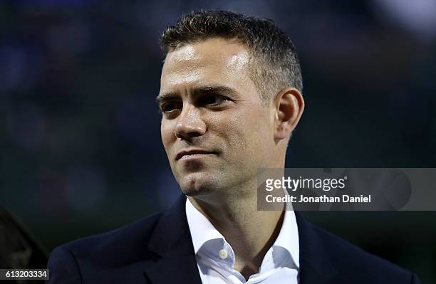 Chicago Cubs general manager Theo Epstein stands on the field during batting practice before the game between the Chicago Cubs and the San Francisco...