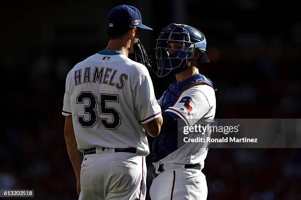 Cole Hamels and Jonathan Lucroy of the Texas Rangers during game one of the American League Divison Series against the Toronto Blue Jays at Globe...