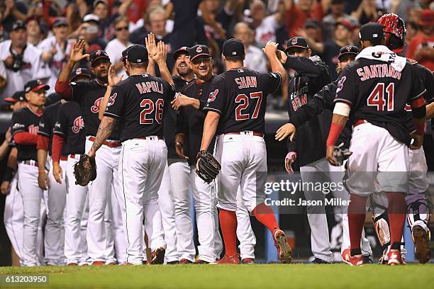 The Cleveland Indians celebrate after defeating the Boston Red Sox 6-0 in game two of the American League Divison Series at Progressive Field on...