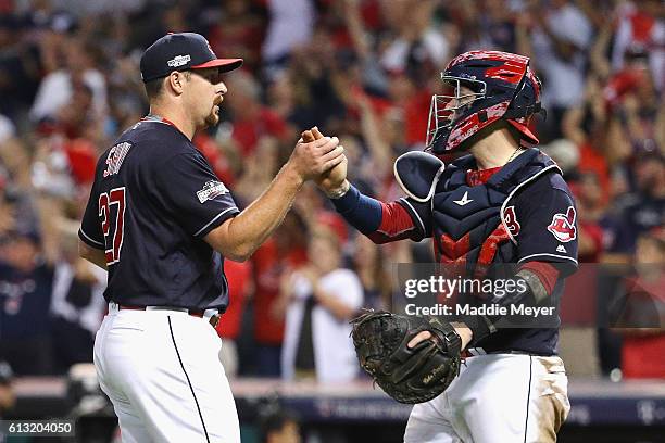 Bryan Shaw of the Cleveland Indians celebrates with Roberto Perez after defeating the Boston Red Sox 6-0 in game two of the American League Divison...