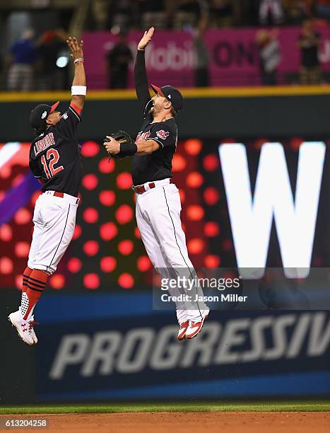 Francisco Lindor of the Cleveland Indians and Lonnie Chisenhall celebrate after defeating the Boston Red Sox 6-0 in game two of the American League...