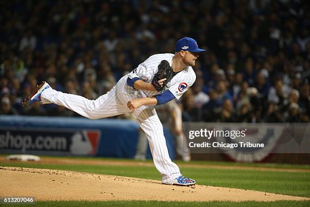 Chicago Cubs starting pitcher Jon Lester works against the San Francisco Giants in the first inning in Game 1 of the National League Division Series...