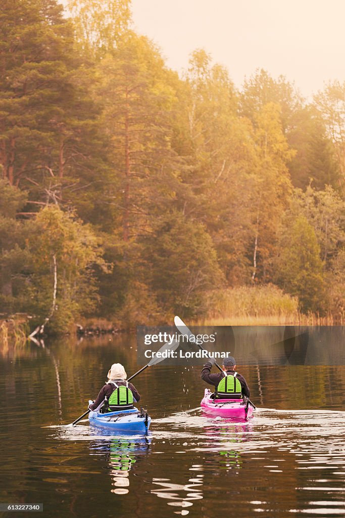 Retired couple out kayaking