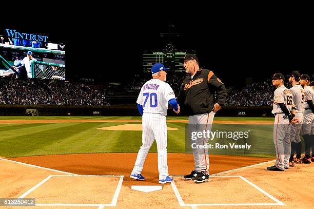 Managers Joe Maddon of the Chicago Cubs and Bruce Bochy of the San Francisco Giants shake hands during player introductions prior to Game 1 of NLDS...