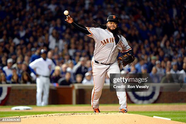 Johnny Cueto of the San Francisco Giants throws to first base during Game 1 of NLDS against the Chicago Cubs at Wrigley Field on Friday, October 7,...