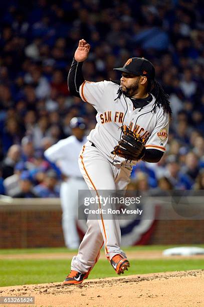Johnny Cueto of the San Francisco Giants pitches in the first inning during Game 1 of NLDS against the Chicago Cubs at Wrigley Field on Friday,...