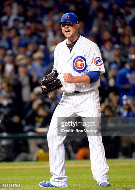 Jon Lester of the Chicago Cubs reacts to getting the final out of the fourth inning during Game 1 of NLDS against the San Francisco Giants at Wrigley...
