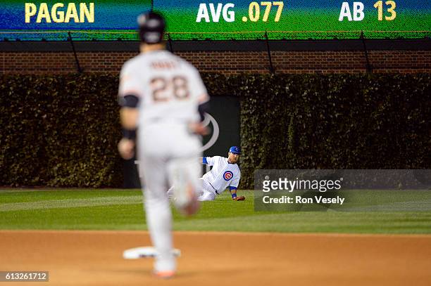 Ben Zobrist of the Chicago Cubs is unable to make the play on a Angel Pagan of the San Francisco Giants double in the fourth inning during Game 1 of...