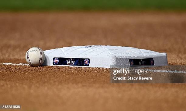 Signage for the 2016 NLDS adorns first base before the game between the Chicago Cubs and the San Francisco Giants at Wrigley Field on October 7, 2016...