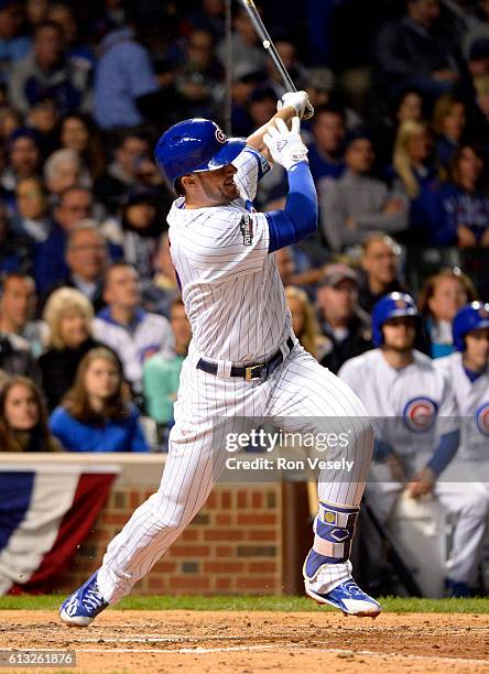 Kris Bryant of the Chicago Cubs doubles in the fourth inning during Game 1 of NLDS against the San Francisco Giants at Wrigley Field on Friday,...